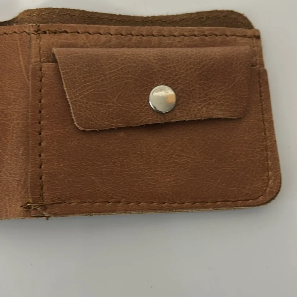Brown Leather Bifold Wallet with Antelope Logo Rugged Safari-Inspired Style